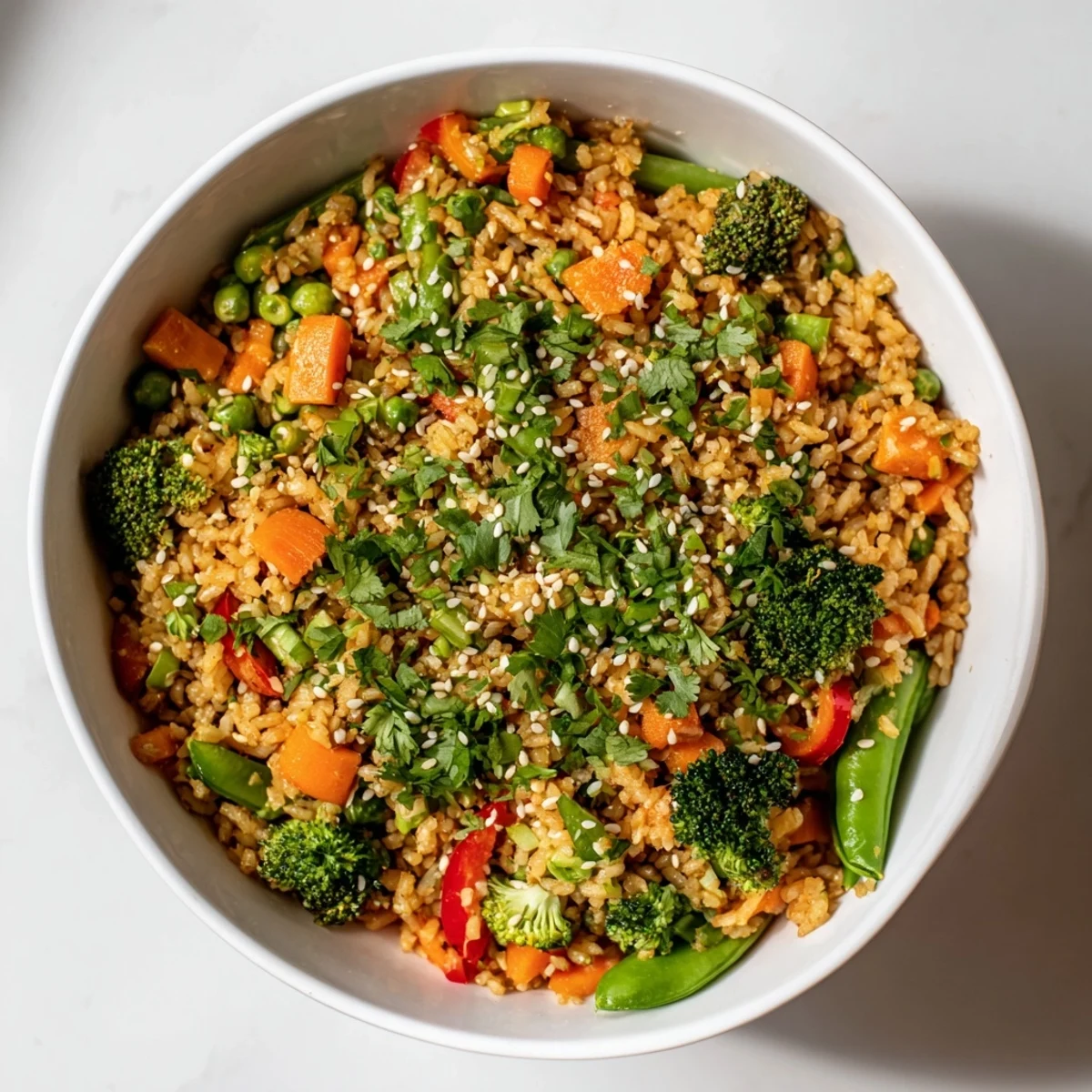 Golden, crispy vegetable fried rice bowls with vibrant colorful vegetables and savory sauce.