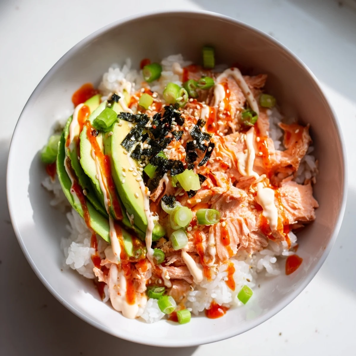 Savory Classic Salmon Rice is shown with colorful toppings, promising a flavorful experience with each spoonful.