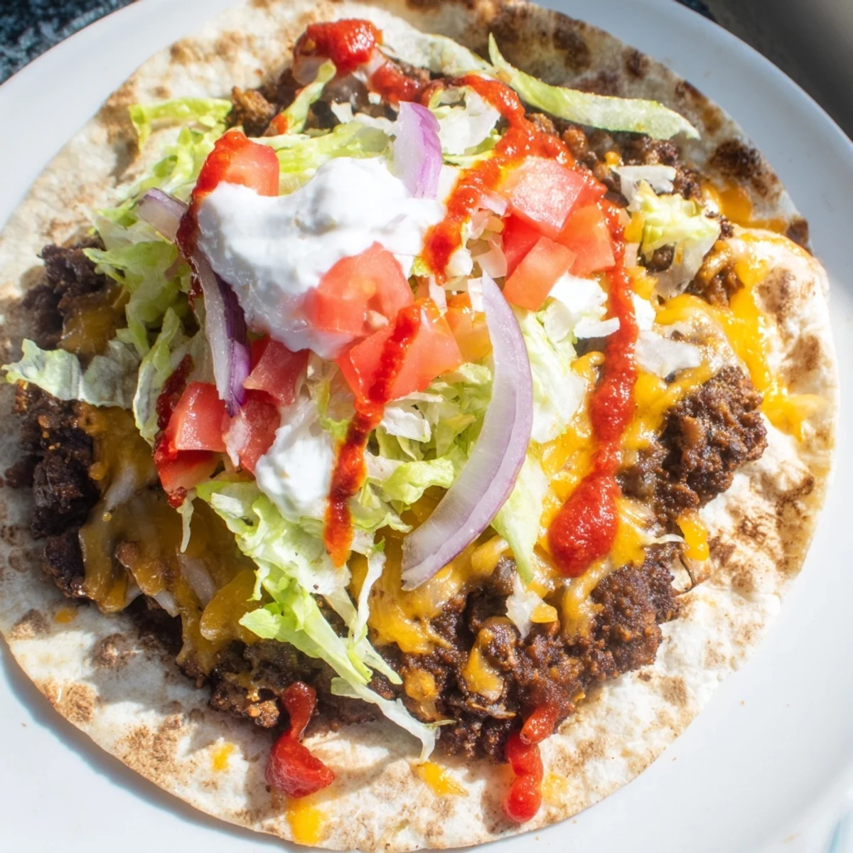 Golden, crispy smash tacos bursting with seasoned beef, melted cheese, and fresh toppings.