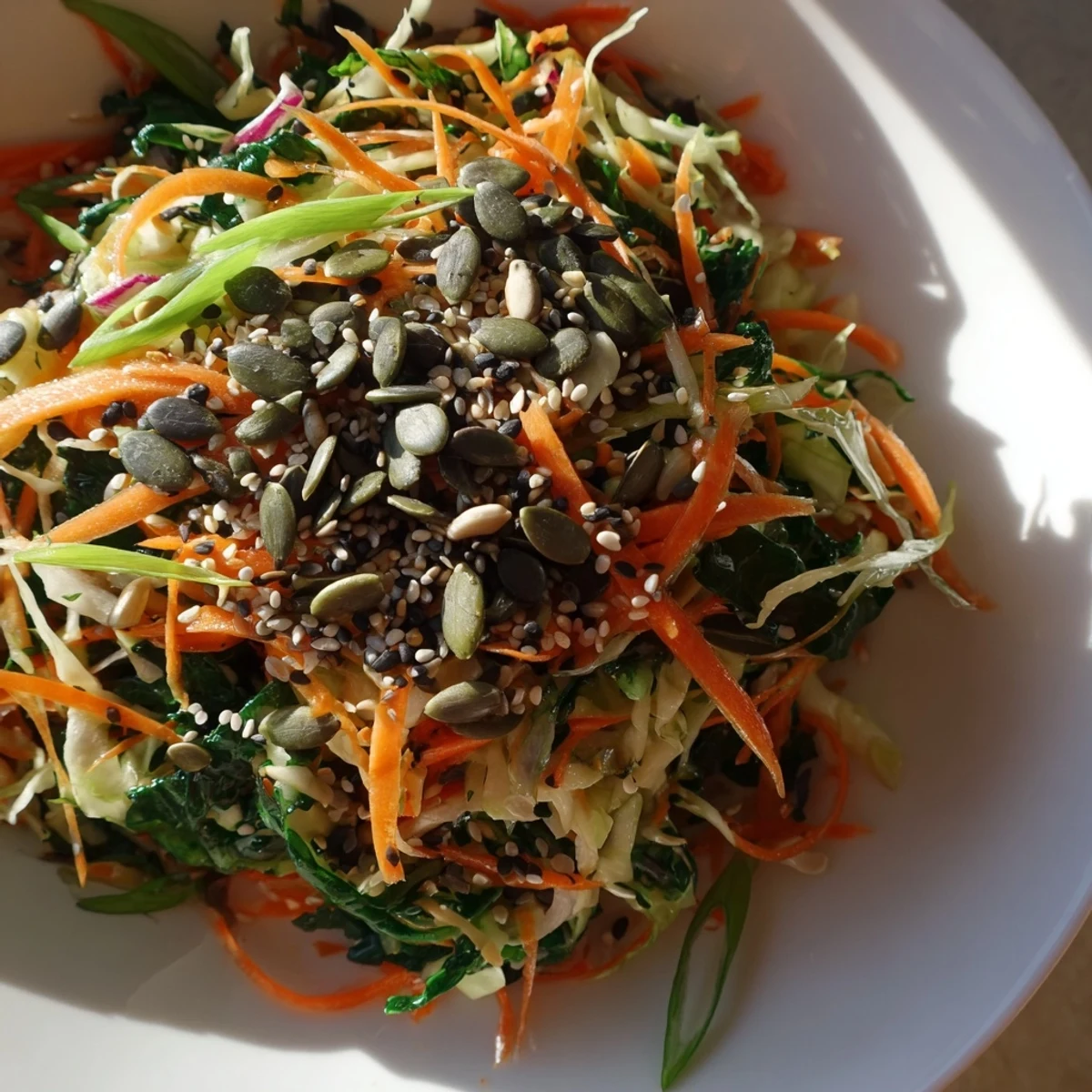 Vibrant Cabbage-Core Slaw Salad, a crunchy mix with toasted seeds and a sesame dressing.