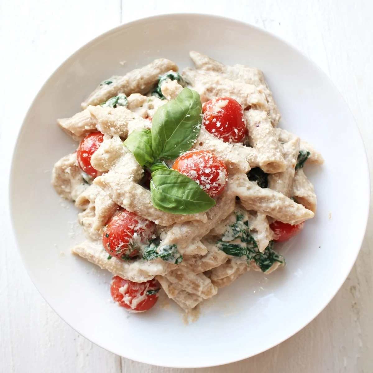 This photo features a steaming bowl of Cottage Cheese High-Protein Creamy Pasta, perfect for a quick dinner.