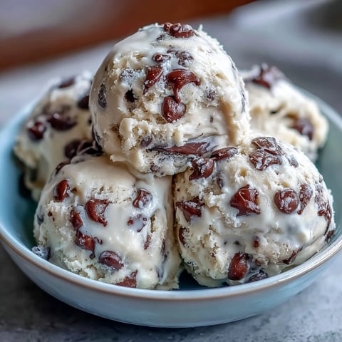 Creamy Greek Yogurt Cookie Dough with melty chocolate chips and buttery sweetness, served chilled in a small bowl.