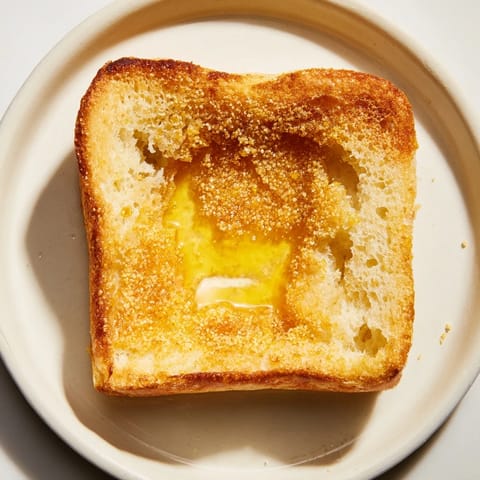 Freshly baked sheet pan English muffins, soft and fluffy, a delicious and easy brunch recipe idea.