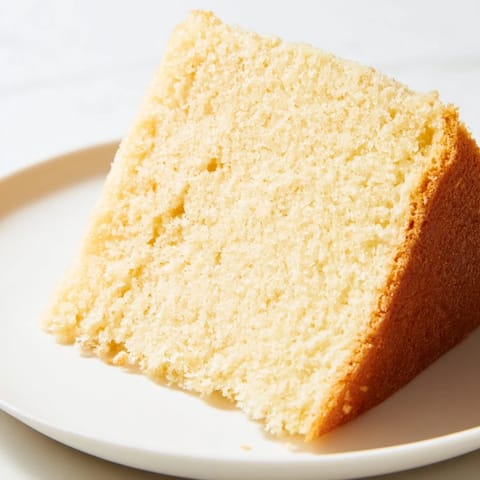 Fluffy 3-ingredient vanilla sponge cake, golden brown, ready for serving or decorating, a perfect dessert.