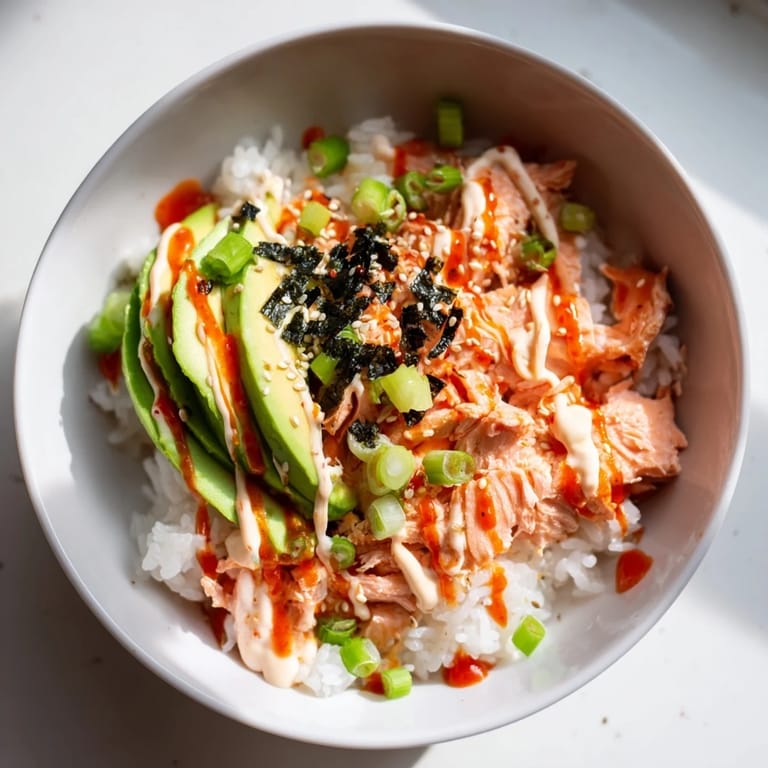 Savory Classic Salmon Rice is shown with colorful toppings, promising a flavorful experience with each spoonful.